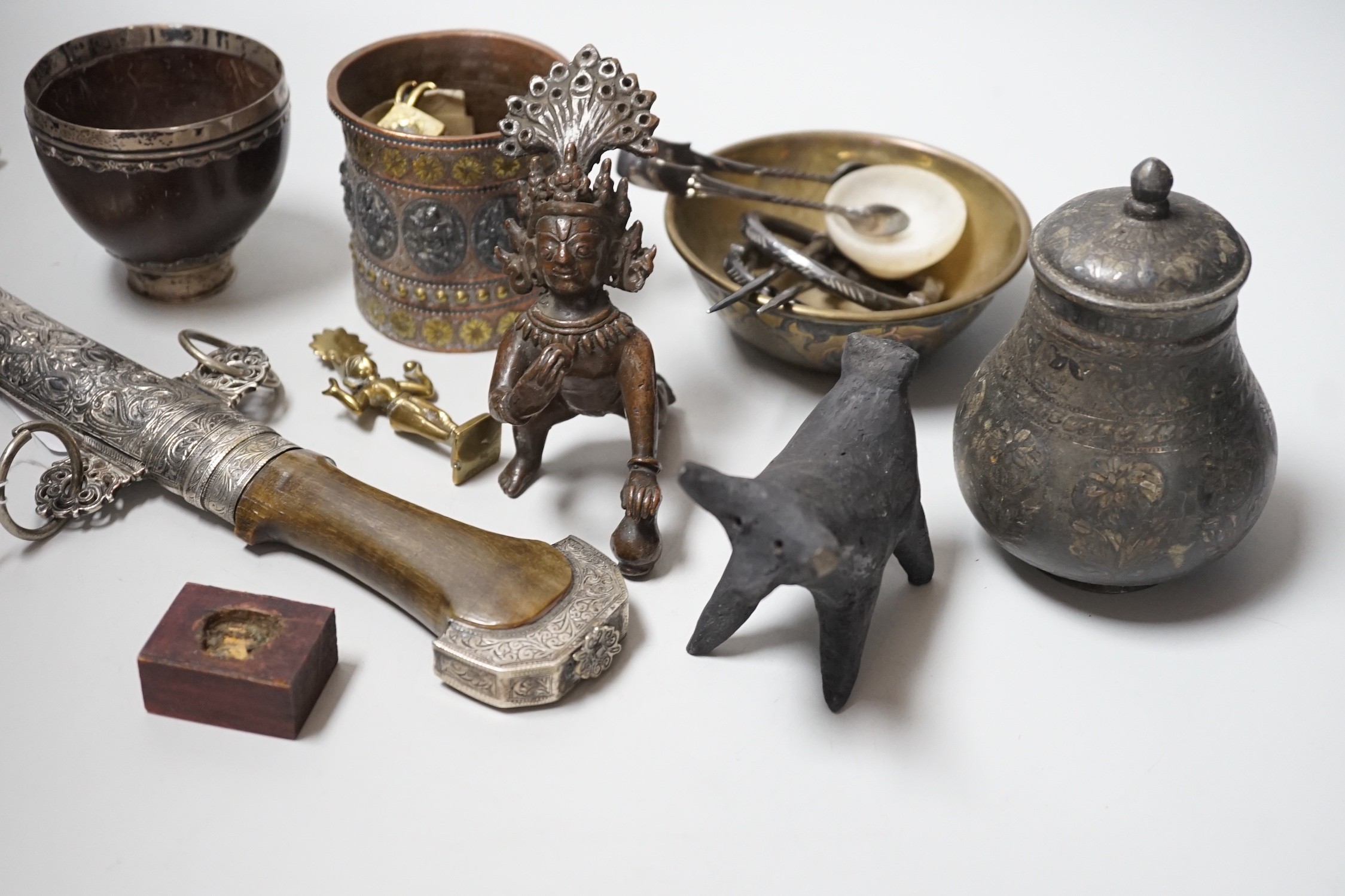 An Eastern white metal mounted dagger, a quantity of Eastern metalware and a white metal-mounted cup